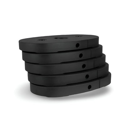 Pile des cinq plaques de poids de 10 lb de l'ensemble d'ajout de poids Inspire Fitness, conçues pour accroître la résistance des équipements compatibles.