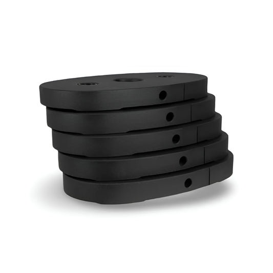 Pile des cinq plaques de poids de 10 lb de l'ensemble d'ajout de poids Inspire Fitness, conçues pour accroître la résistance des équipements compatibles.